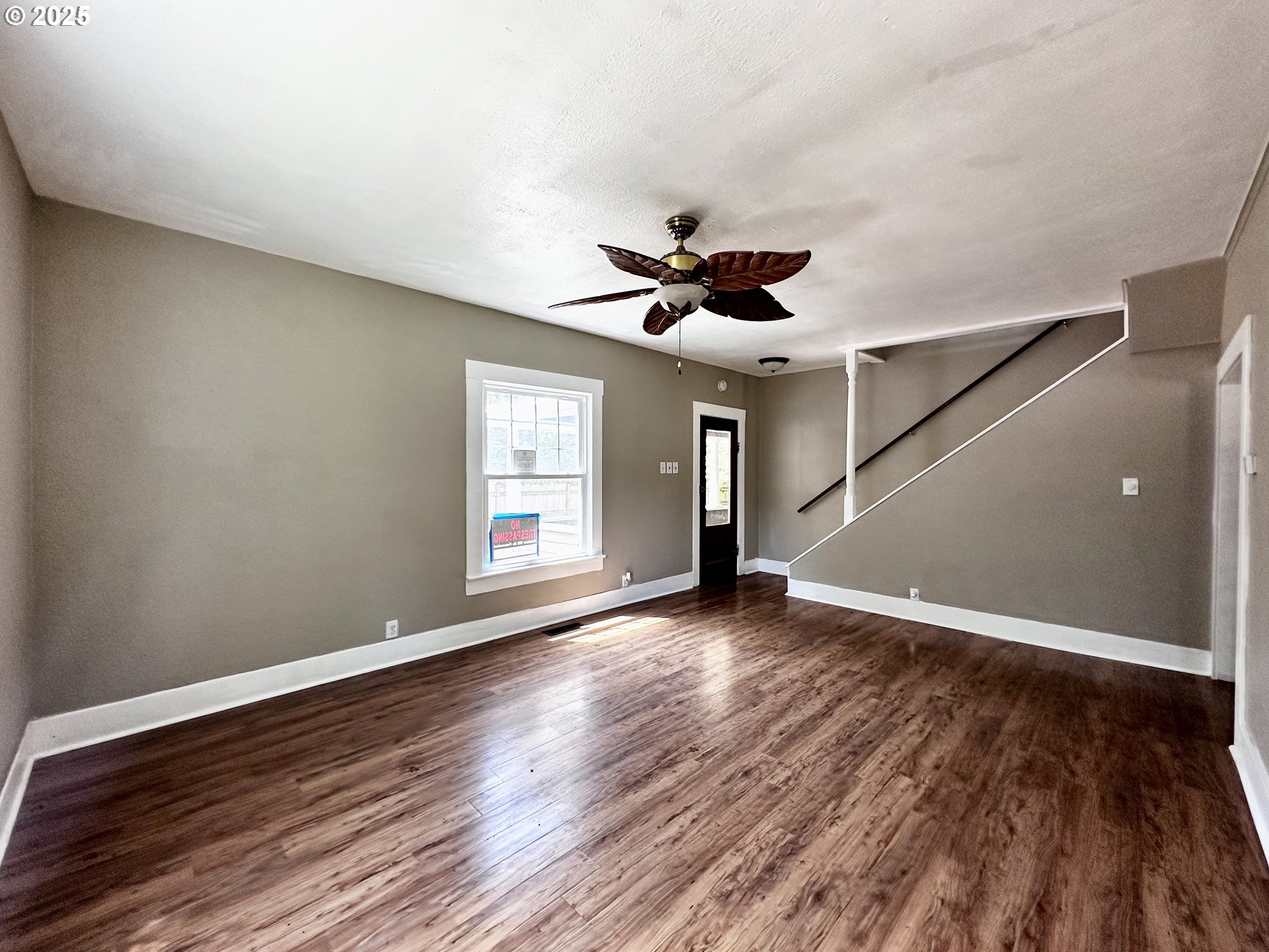 2453 Highway 20 Albany, OR 97321 - Photo 8 of 47 a view of an empty room with wooden floor and a window