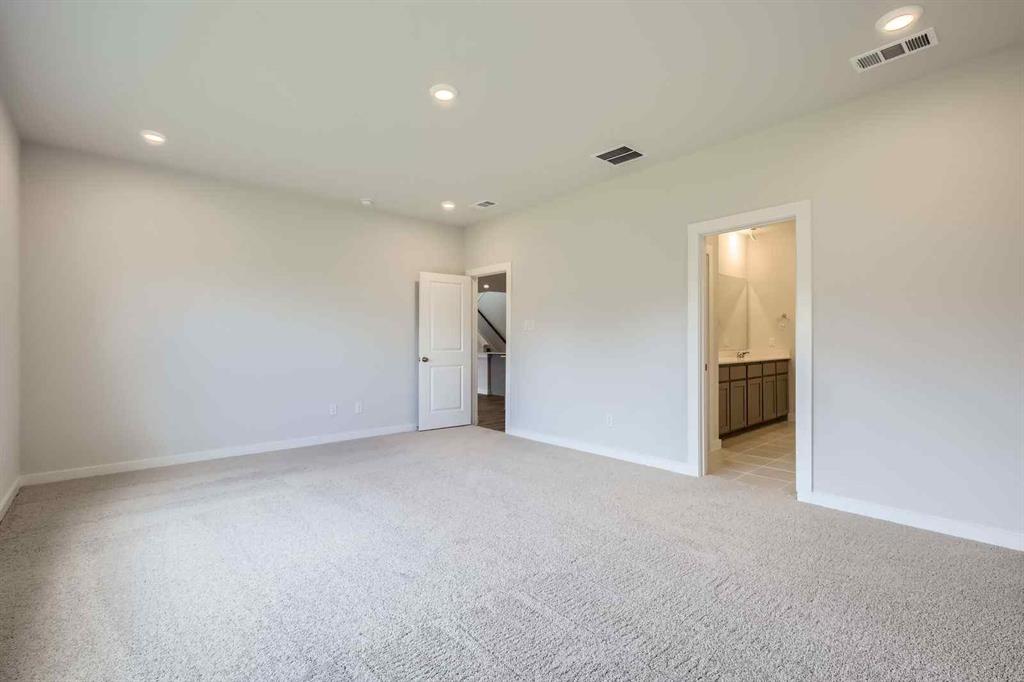694 Cari Lane Forney, TX 75126 - Photo 12 of 40 an empty room with closet and a bathroom
