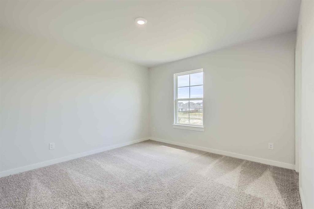 694 Cari Lane Forney, TX 75126 - Photo 20 of 40 an empty room with windows