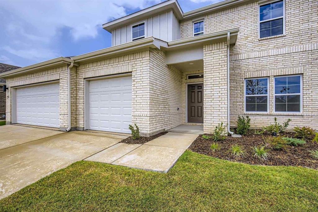 694 Cari Lane Forney, TX 75126 - Photo 2 of 40 a front view of a house with a yard