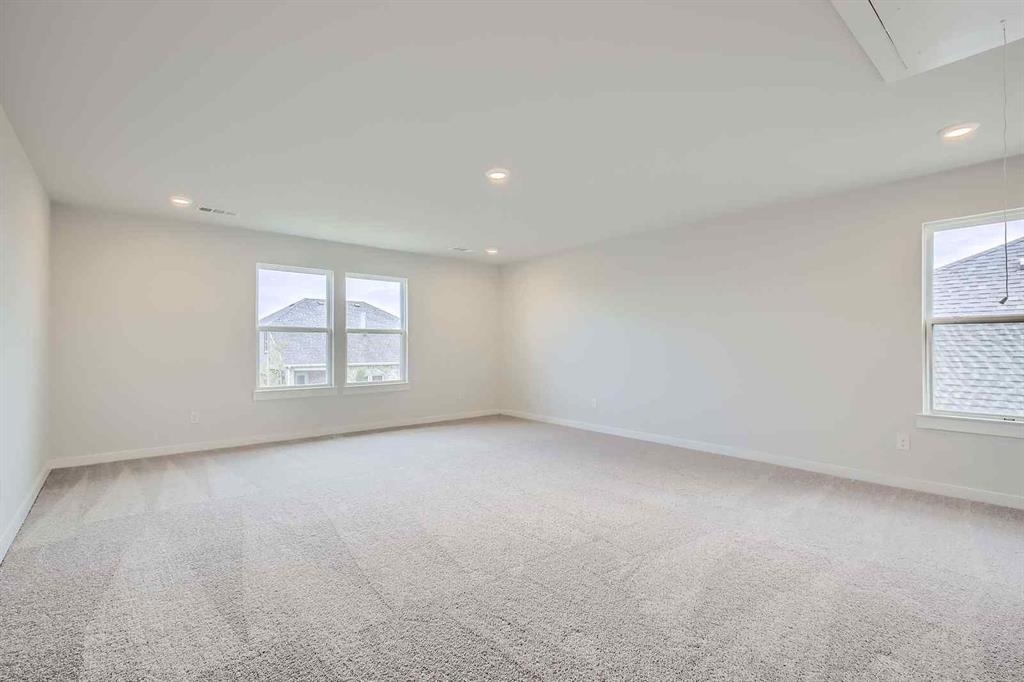 694 Cari Lane Forney, TX 75126 - Photo 22 of 40 an empty room with windows