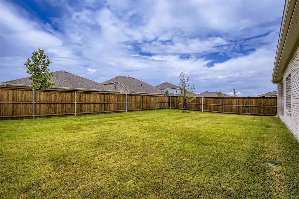 694 Cari Lane Forney, TX 75126 - Photo 24 of 40 a view of an outdoor space and a yard