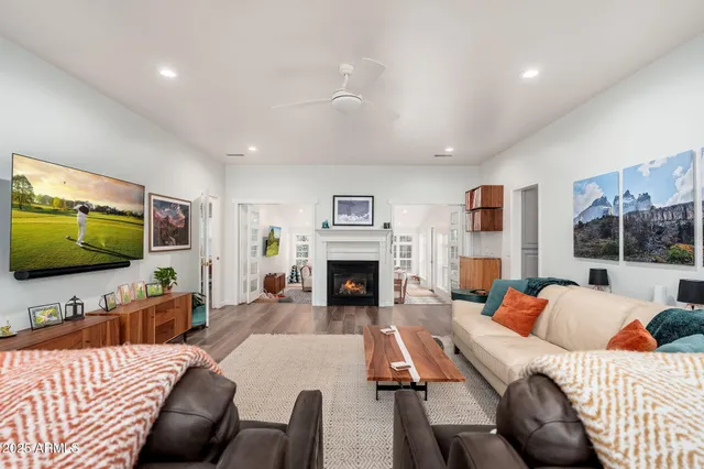 a living room with furniture and a fireplace