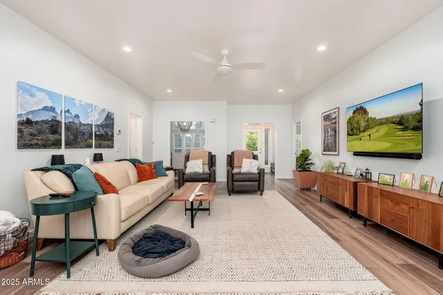a bedroom with a bed and glass window