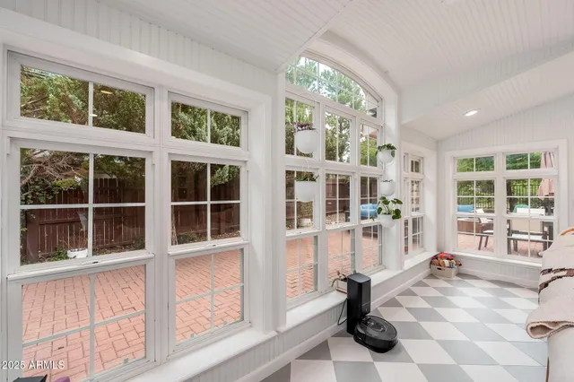 a kitchen with granite countertop a sink a window and stainless steel appliances