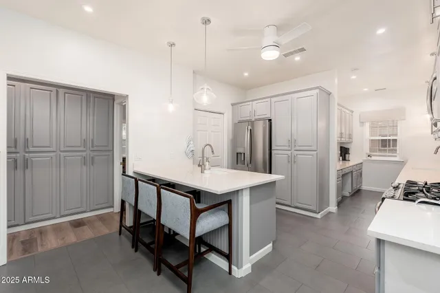 a bathroom with a tub sink and glass door shower
