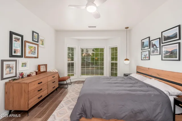 a bathroom with a sink mirror vanity and toilet