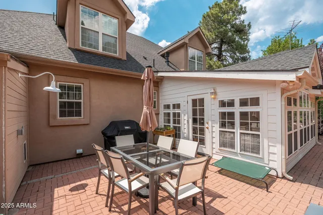 a view of a swimming pool and a back yard