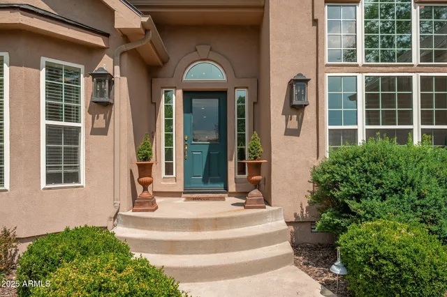a view of a dining room with furniture wooden floor and chandelier