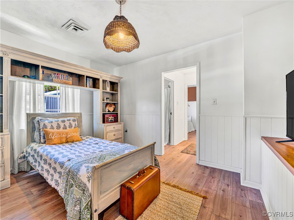 2632 Paisley Road Gretna, VA 24557 - Photo 16 of 49 a bedroom with a bed and wooden floor