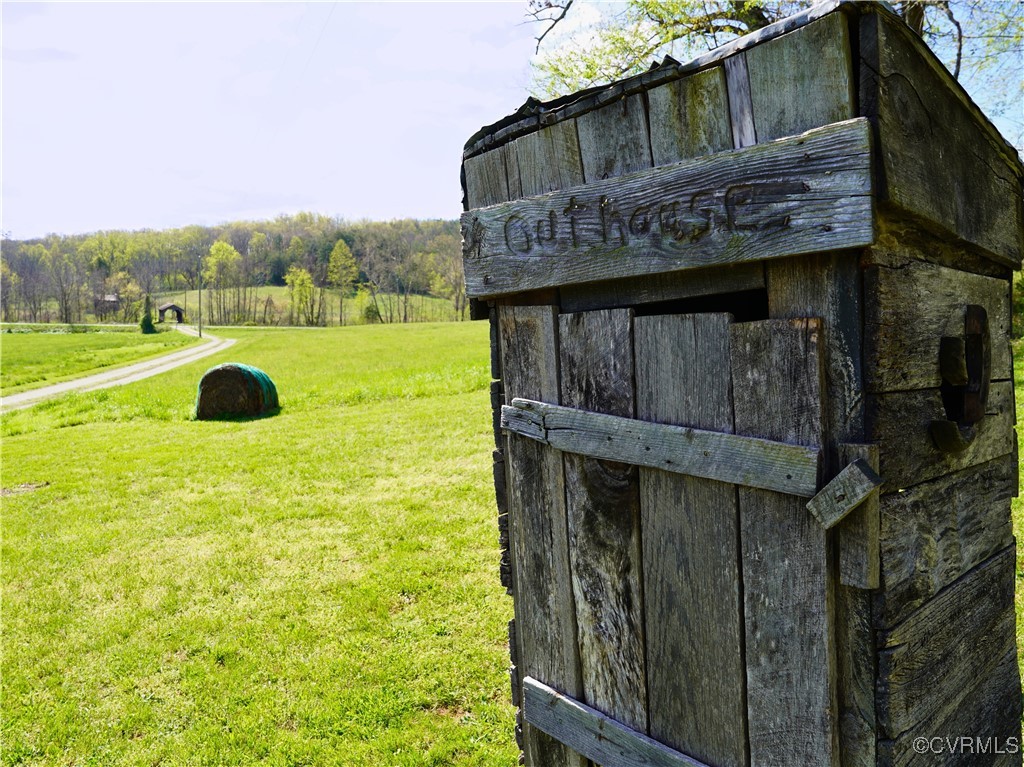 2632 Paisley Road Gretna, VA 24557 - Photo 27 of 49 a yellow house with trees in front of it