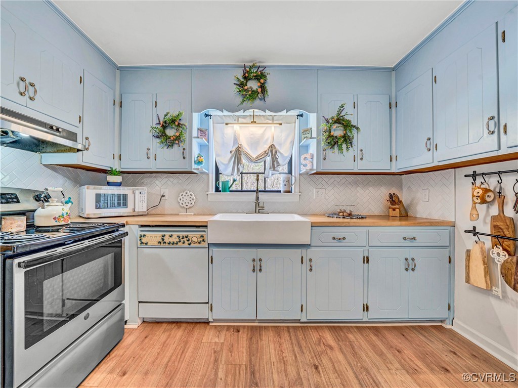 2632 Paisley Road Gretna, VA 24557 - Photo 4 of 49 a kitchen with a sink cabinets stainless steel appliances and a window