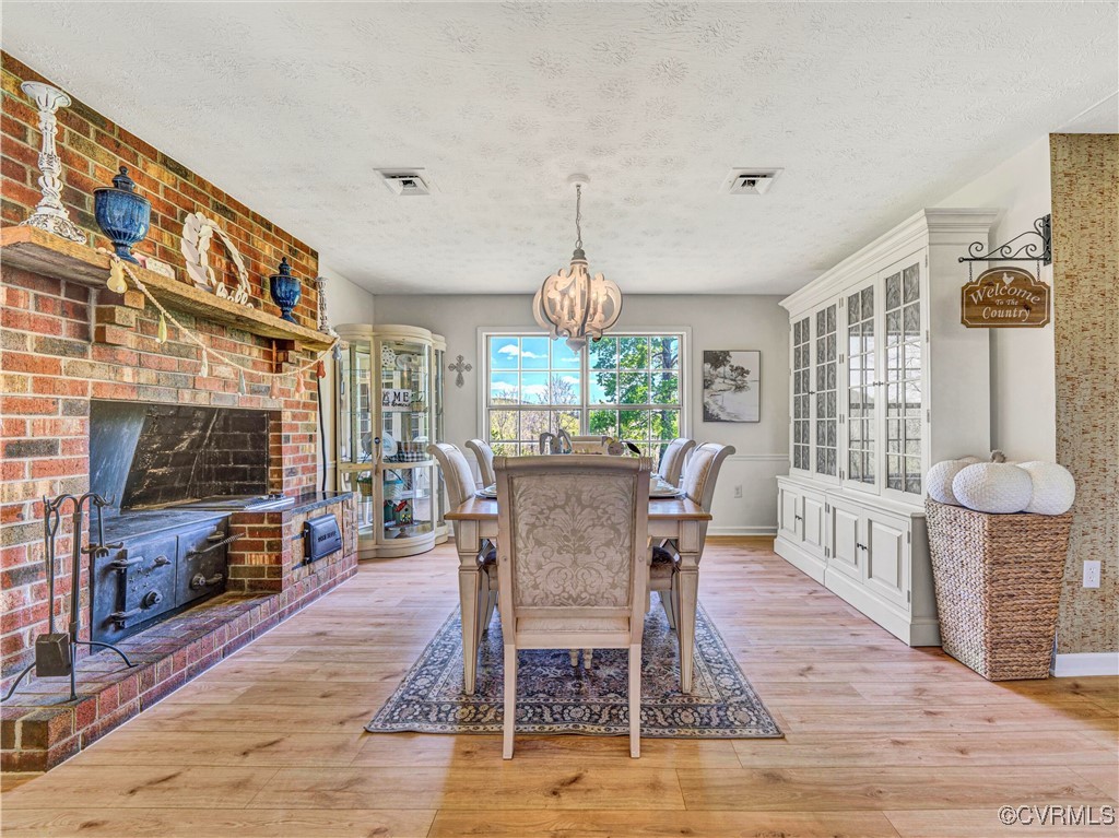 2632 Paisley Road Gretna, VA 24557 - Photo 8 of 49 a view of a dining room with furniture window and wooden floor