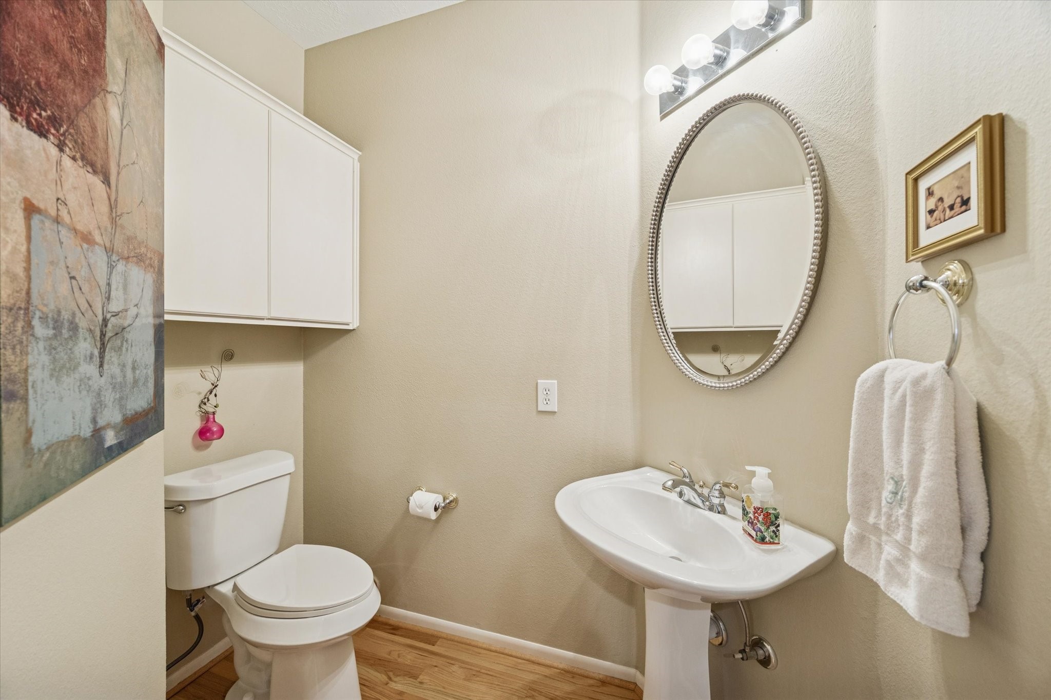 210 Malone Street Houston, TX 77007 - Photo 14 of 35 a bathroom with a sink mirror and toilet