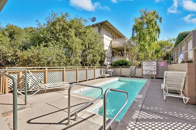 a view of a chairs and table in the patio