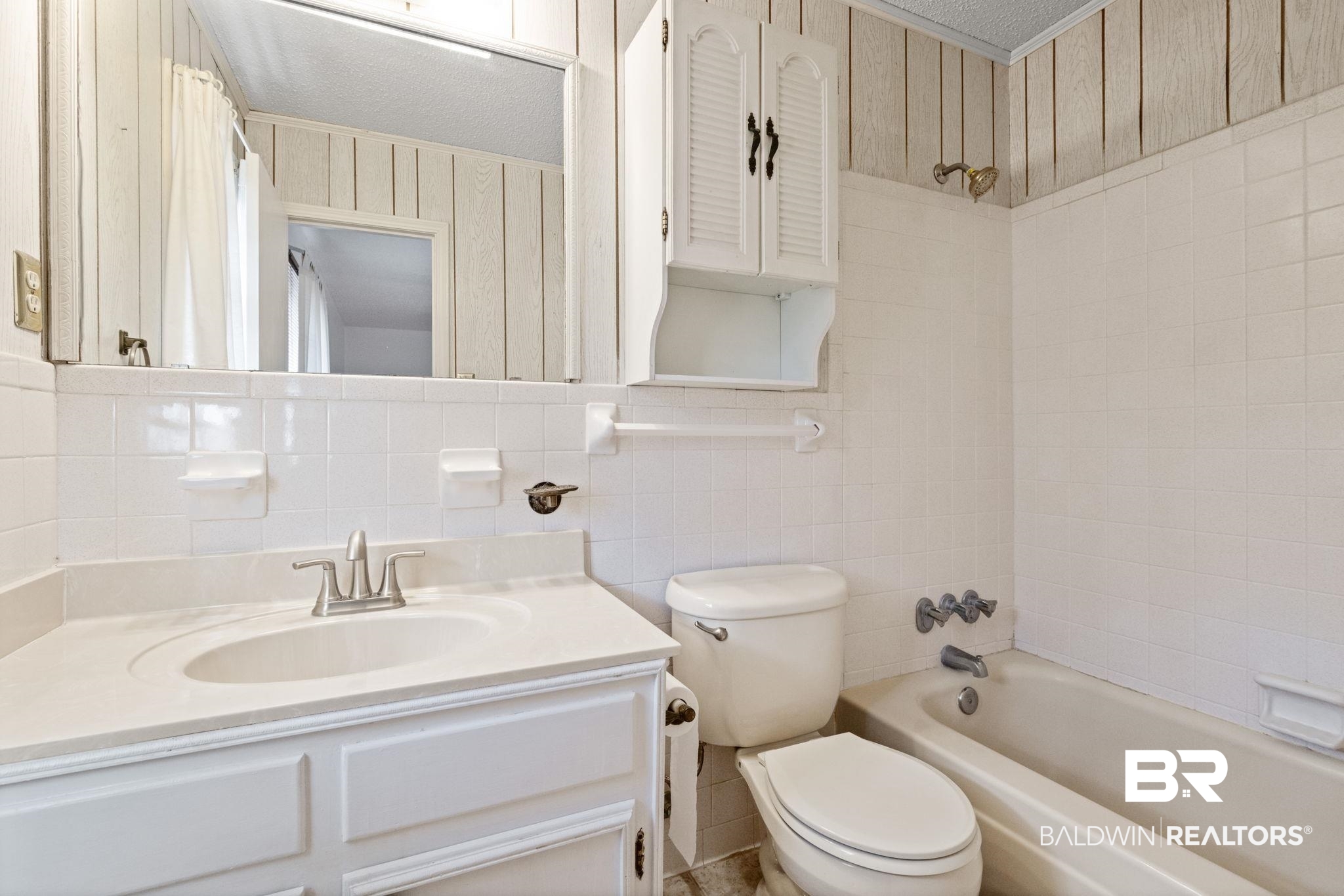 6261 Old Pascagoula Road Theodore, AL 36582 - Photo 27 of 29 Full bathroom with tile walls, vanity, toilet, shower / bathtub combination with curtain, and a textured ceiling