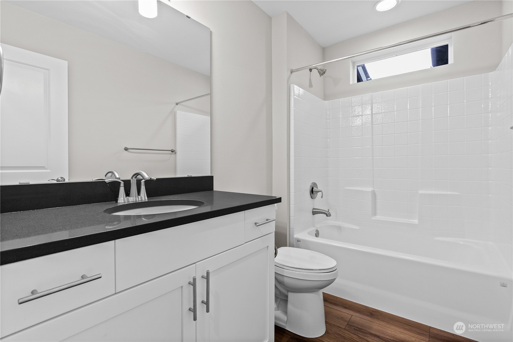 23802 7th Avenue Southeast, Unit C Bothell, WA 98021 - Photo 21 of 28 a bathroom with a granite countertop sink a toilet and shower