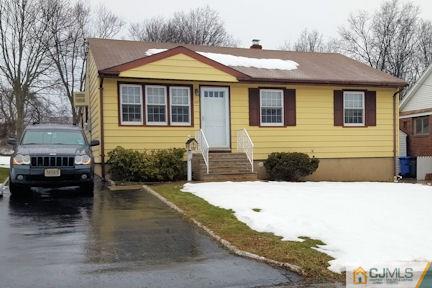 10 Maple Road Iselin, NJ 08830 - Photo 1 of 15 a front view of a house with a yard