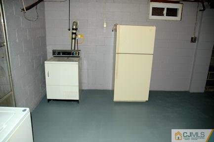 10 Maple Road Iselin, NJ 08830 - Photo 13 of 15 a utility room with washer and dryer