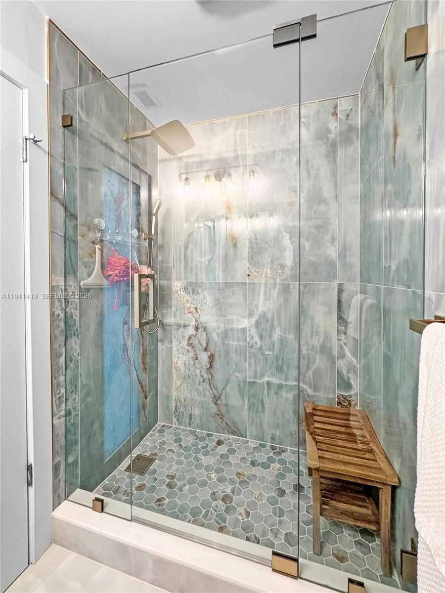 1977 Southwest 15th Street, Unit 116 Deerfield Beach, FL 33442 - Photo 19 of 37 a bathroom with a shower