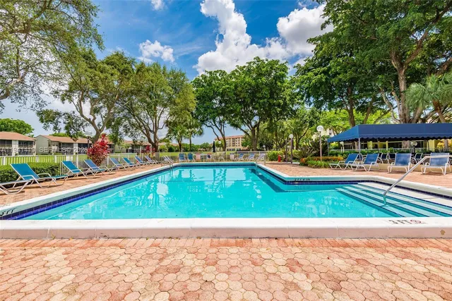 a view of swimming pool with a yard