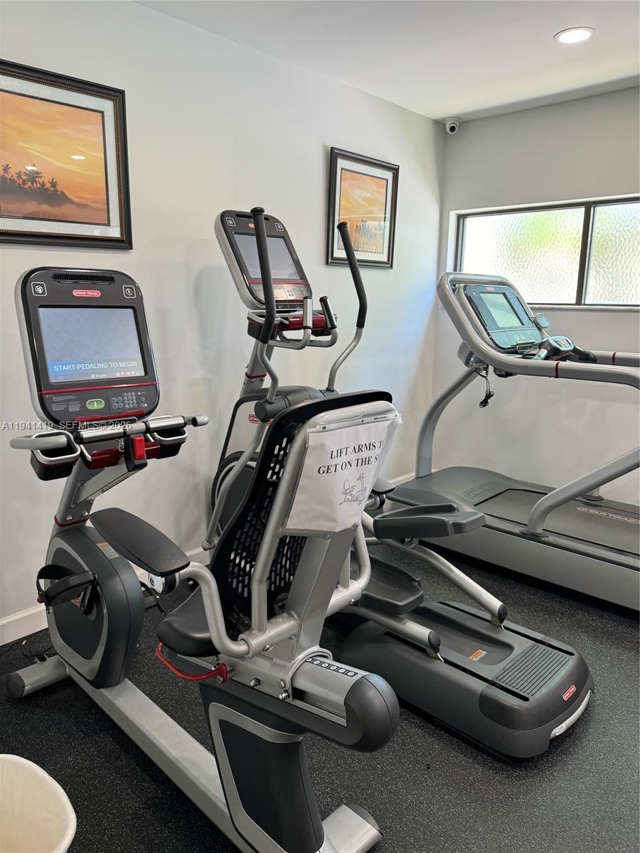 1977 Southwest 15th Street, Unit 116 Deerfield Beach, FL 33442 - Photo 35 of 37 a view of a room with gym equipment