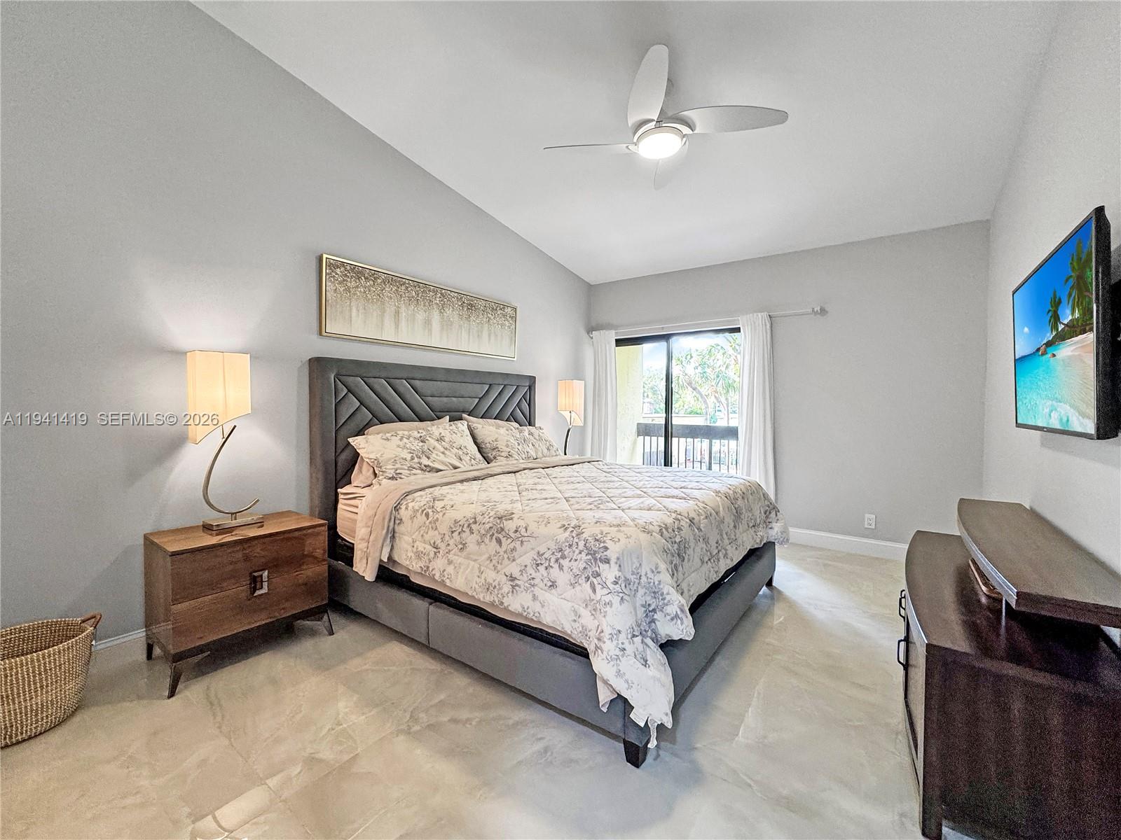 1977 Southwest 15th Street, Unit 116 Deerfield Beach, FL 33442 - Photo 9 of 37 a bedroom with a bed dresser and a window