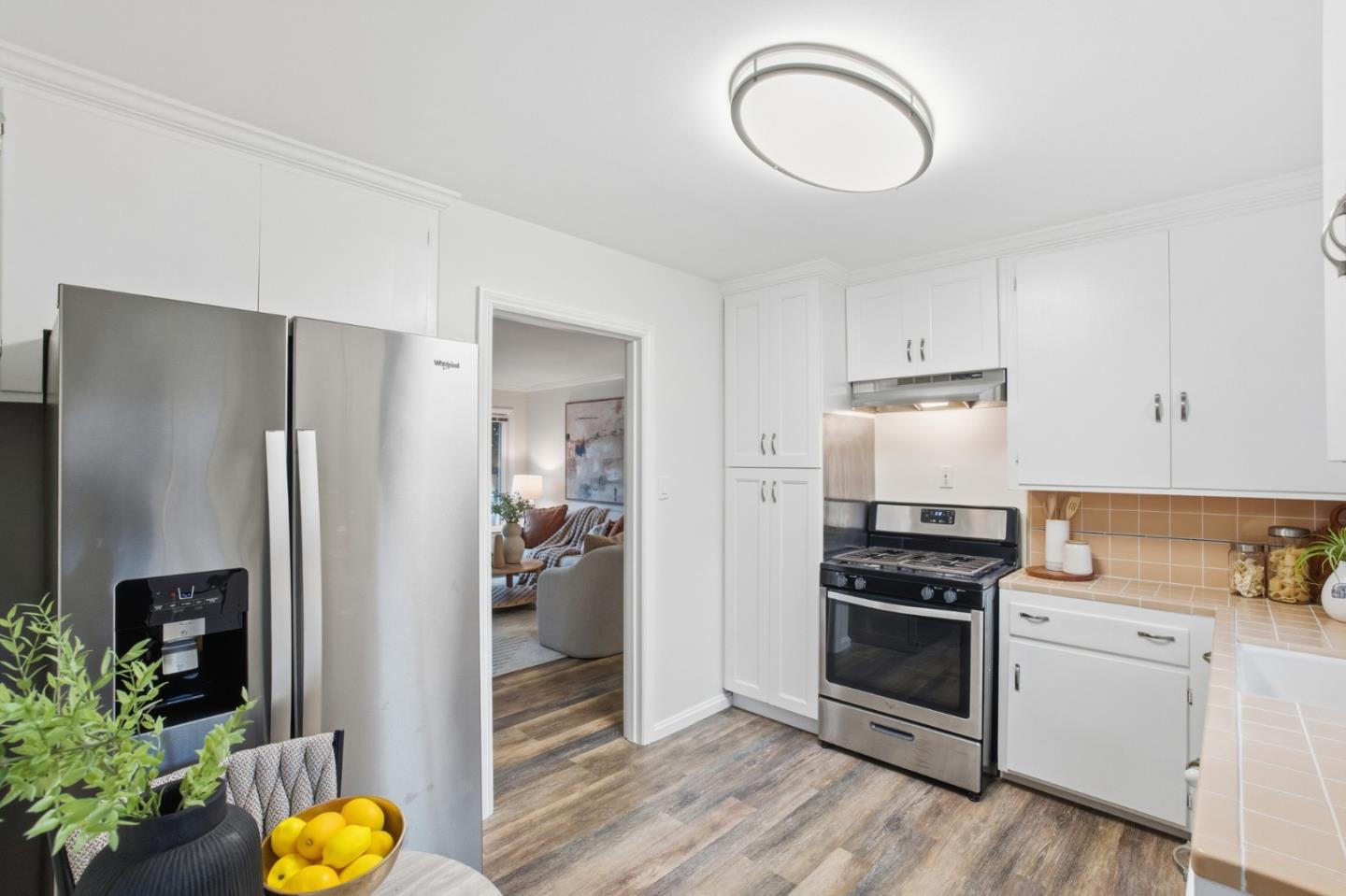 200 Anita Road Burlingame, CA 94010 - Photo 13 of 50 a kitchen with stainless steel appliances a stove a refrigerator and a refrigerator