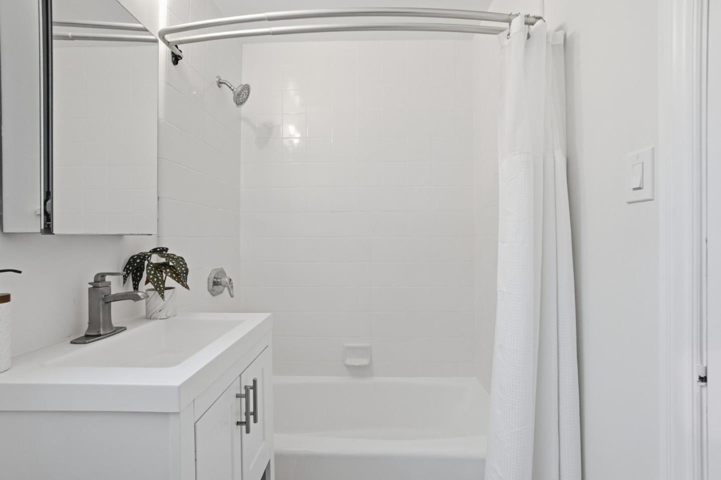200 Anita Road Burlingame, CA 94010 - Photo 18 of 50 a bathroom with a sink and a mirror