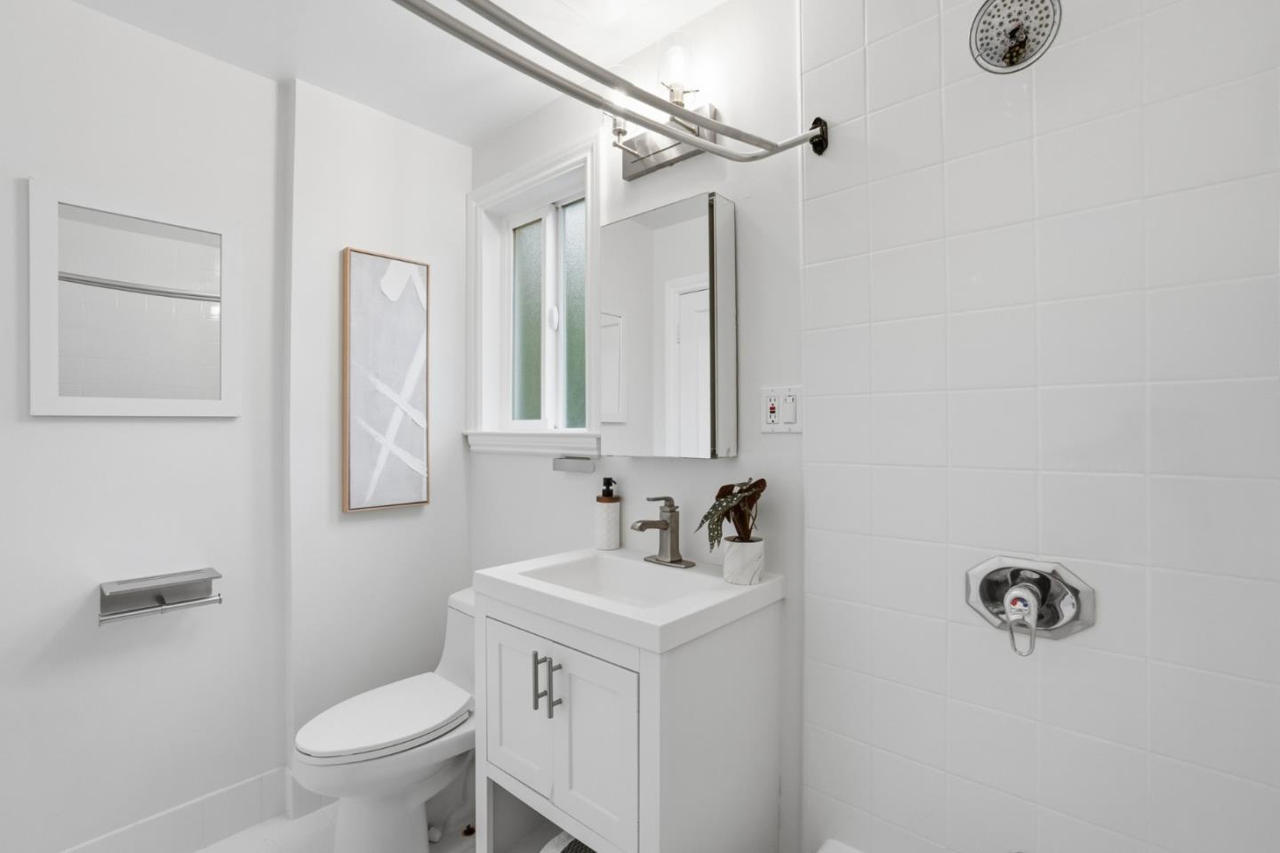 200 Anita Road Burlingame, CA 94010 - Photo 19 of 50 a bathroom with a sink toilet and mirror