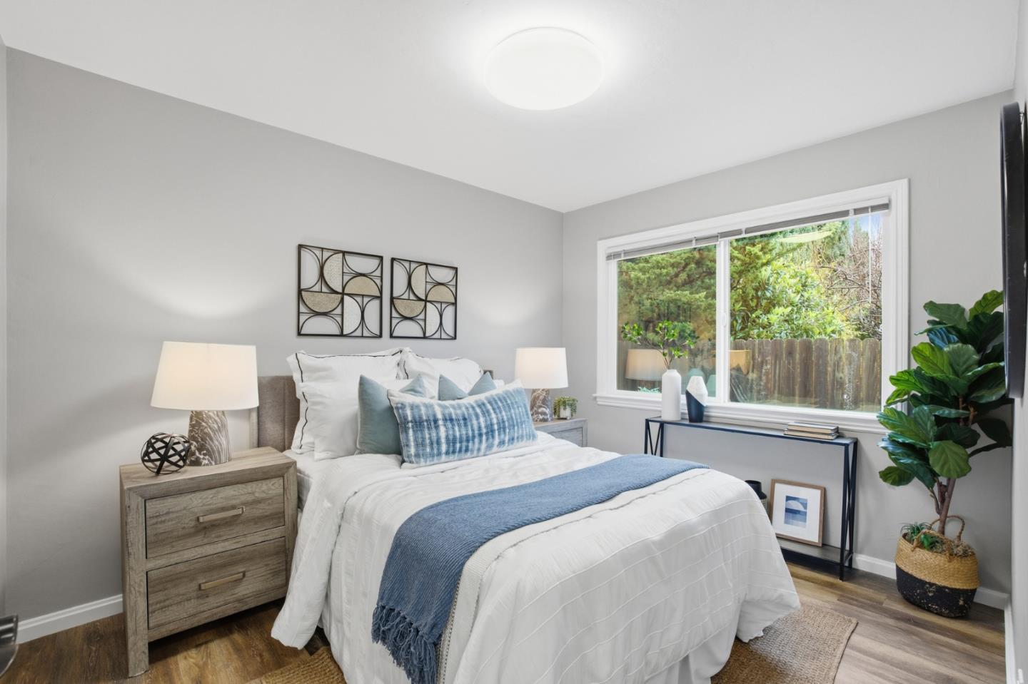 200 Anita Road Burlingame, CA 94010 - Photo 20 of 50 a bedroom with a bed and a potted plant