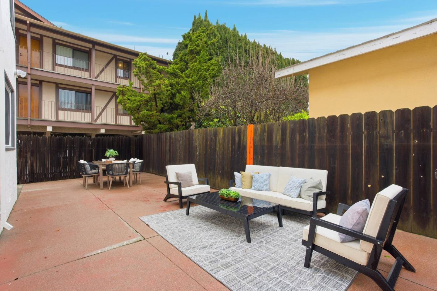 200 Anita Road Burlingame, CA 94010 - Photo 26 of 50 a view of backyard with seating space and wooden fence