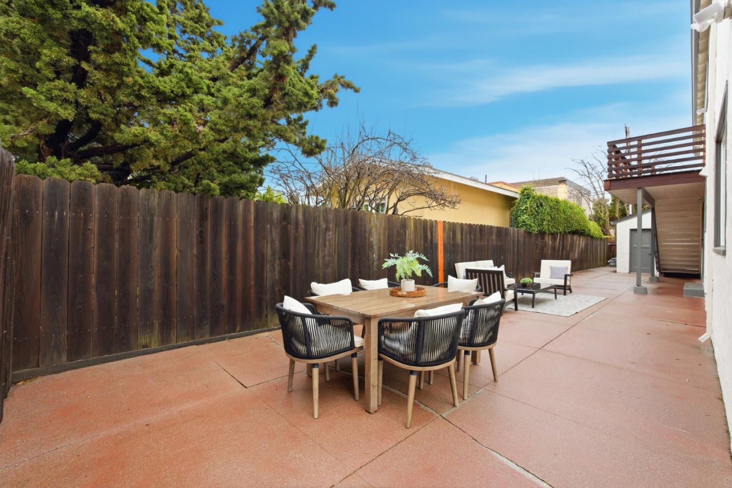 200 Anita Road Burlingame, CA 94010 - Photo 27 of 50 a view of a dinning table and chairs in the patio