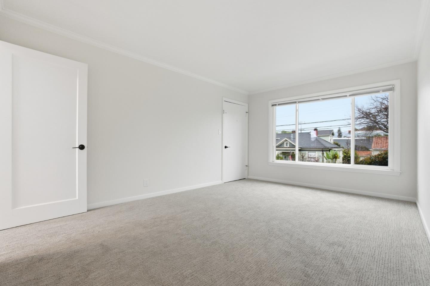 200 Anita Road Burlingame, CA 94010 - Photo 34 of 50 a view of a big room with windows and chandelier fan