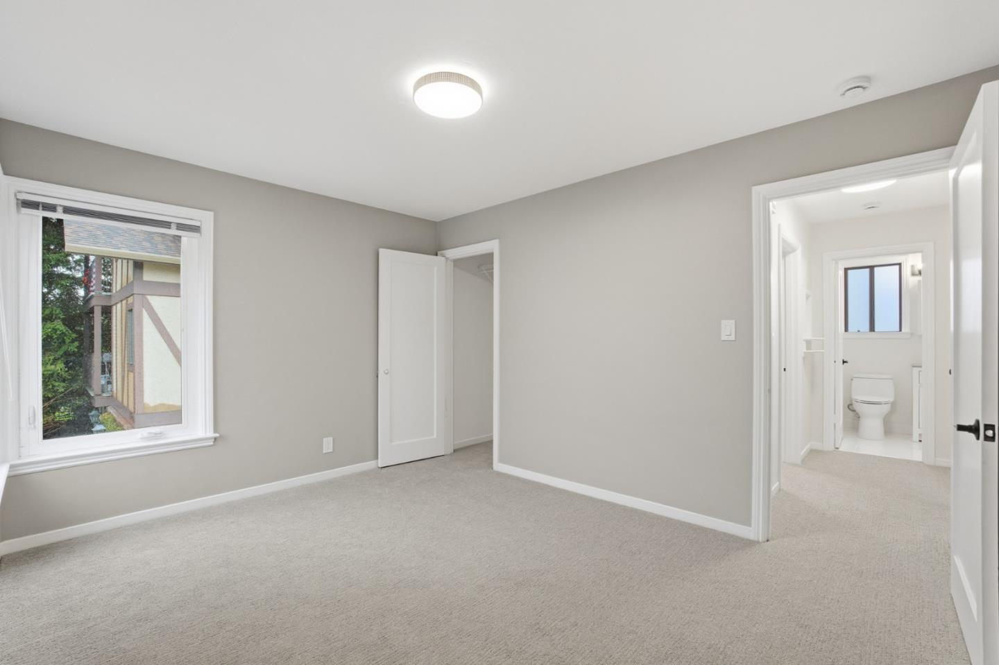 200 Anita Road Burlingame, CA 94010 - Photo 39 of 50 an empty room with windows and closet