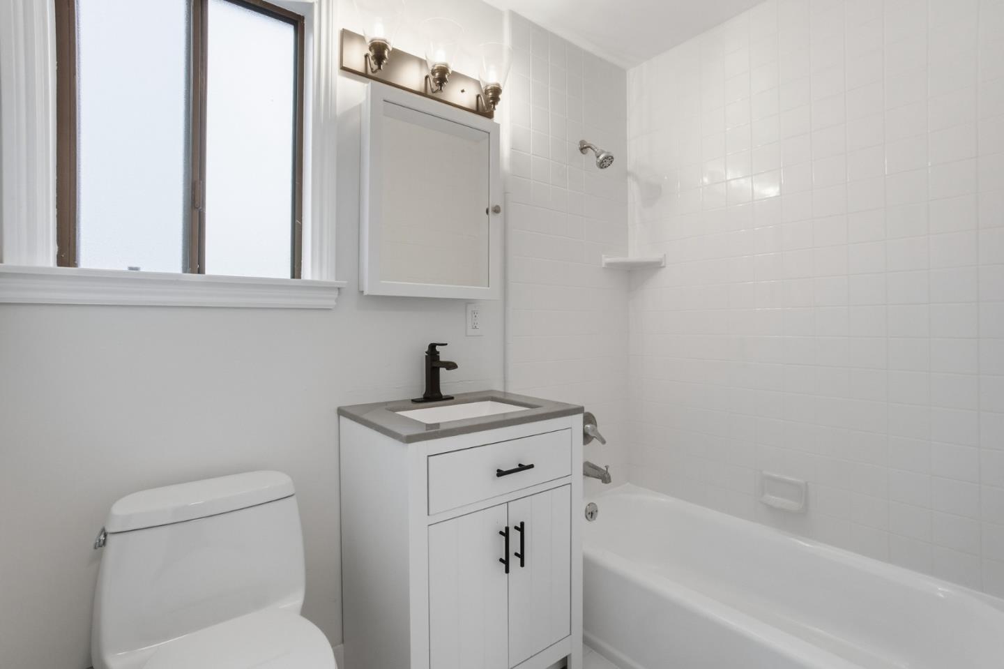 200 Anita Road Burlingame, CA 94010 - Photo 42 of 50 a bathroom with a sink a toilet and bathtub