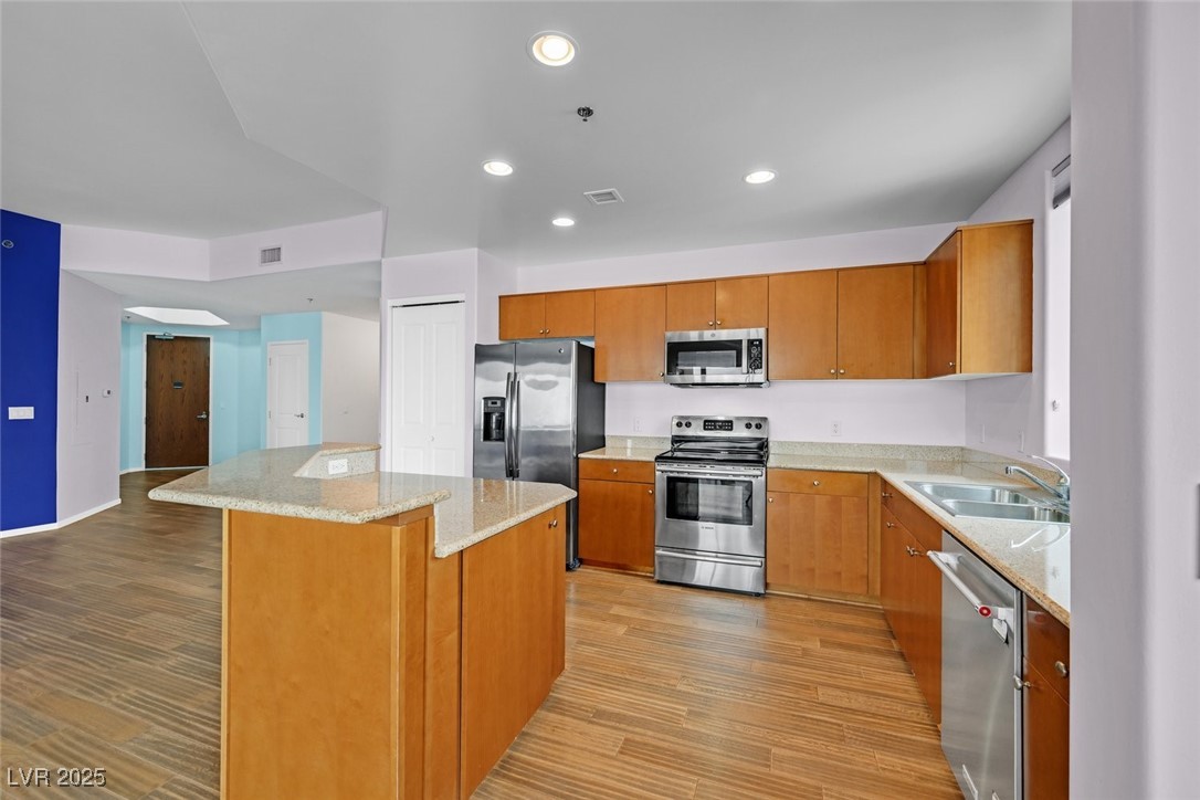 8255 South Las Vegas Boulevard, Unit 1812 Las Vegas, NV 89123 - Photo 11 of 43 Kitchen with stainless steel appliances, light granite countertops.