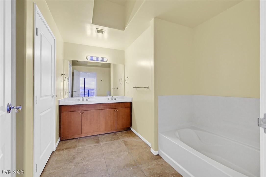 8255 South Las Vegas Boulevard, Unit 1812 Las Vegas, NV 89123 - Photo 23 of 43 ensuite bathroom - 3rd bedroom with double closets, tub and separate shower.