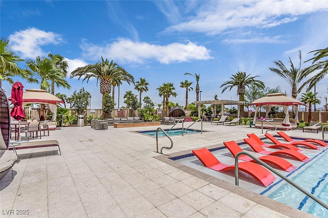 8255 South Las Vegas Boulevard, Unit 1812 Las Vegas, NV 89123 - Photo 31 of 43 Community pool with a gorgeous patio with covered spaces