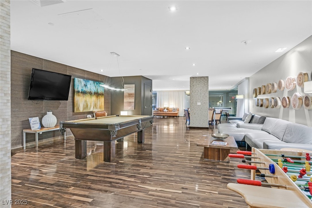 8255 South Las Vegas Boulevard, Unit 1812 Las Vegas, NV 89123 - Photo 38 of 43 Community Game room featuring wood finished floors, billiards, TV and fun vibes