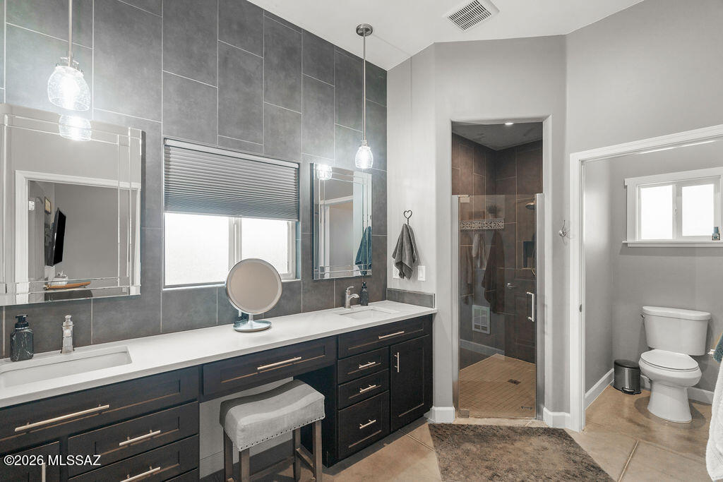 16276 East Empire View Road Vail, AZ 85641 - Photo 38 of 51 a bathroom with a sink a toilet and shower