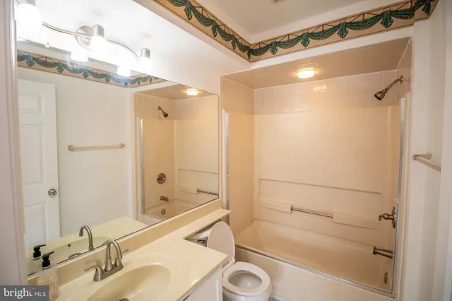 a bathroom with a shower and a sink