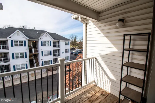 a view of a houses from a balcony