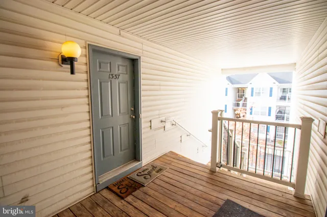 a view of a balcony with wooden floor