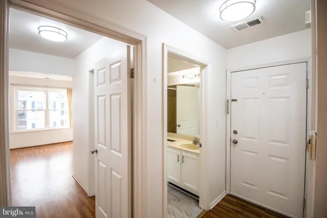 a view of a bathroom with sink and shower