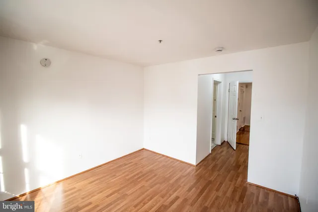 a view of hallway with wooden floor