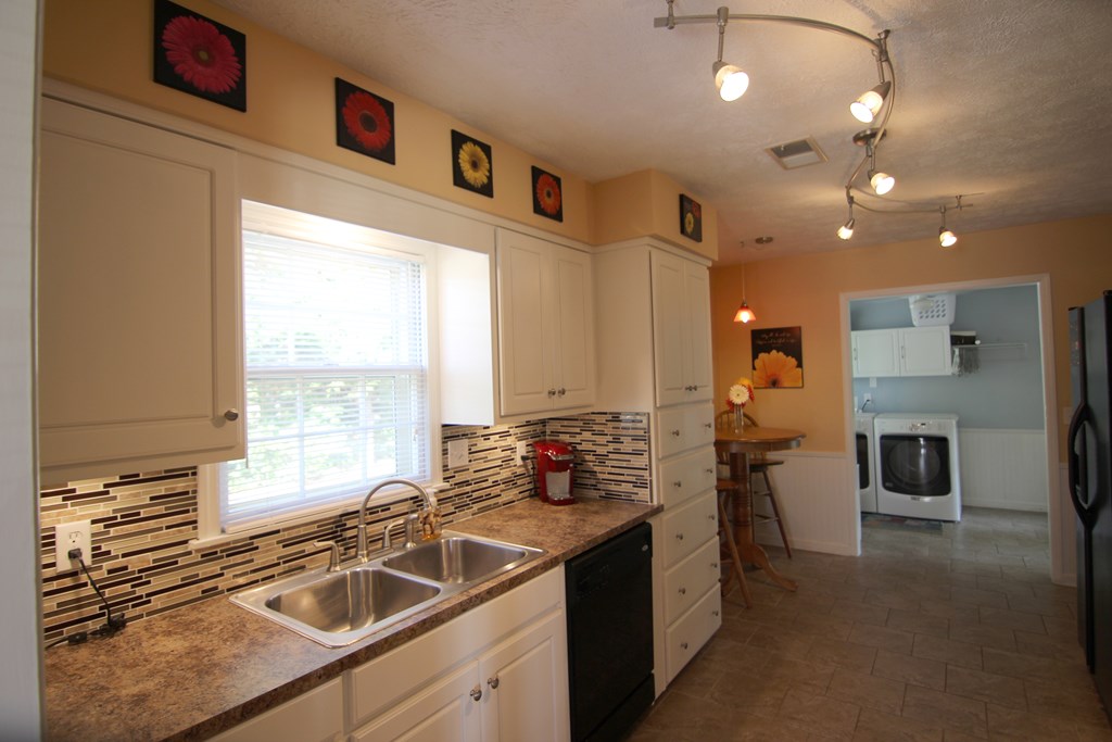 6180 Candlestick Loop Columbus, GA 31909 - Photo 17 of 28 KITCHEN TO LAUNDRY