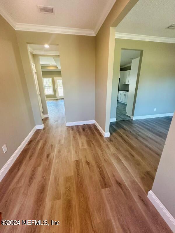 868 Jones Road Jacksonville, FL 32220 - Photo 12 of 19 a view of a room with wooden floor and a bathroom