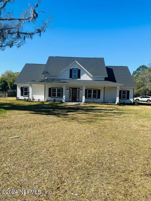 868 Jones Road Jacksonville, FL 32220 - Photo 2 of 19 a front view of a building with a lake view