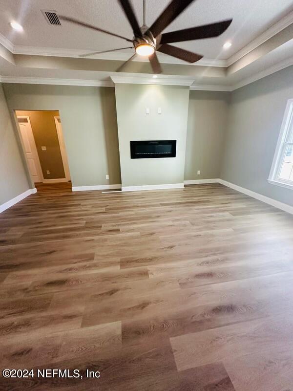 868 Jones Road Jacksonville, FL 32220 - Photo 5 of 19 a view of empty room with wooden floor